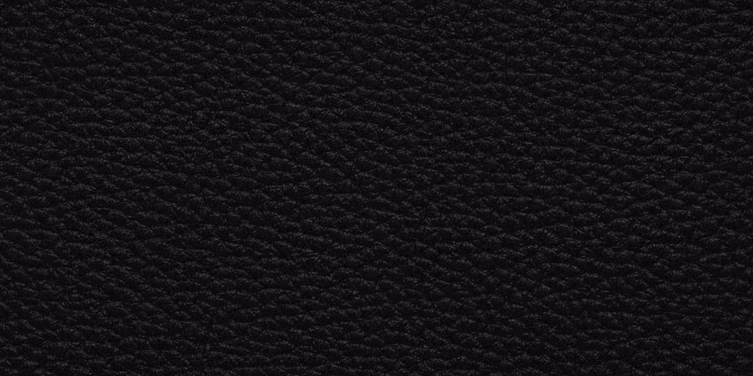 A brown Stanmore III speaker standing on a teak bookshelf